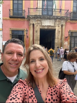 A couple in front of a Seville building